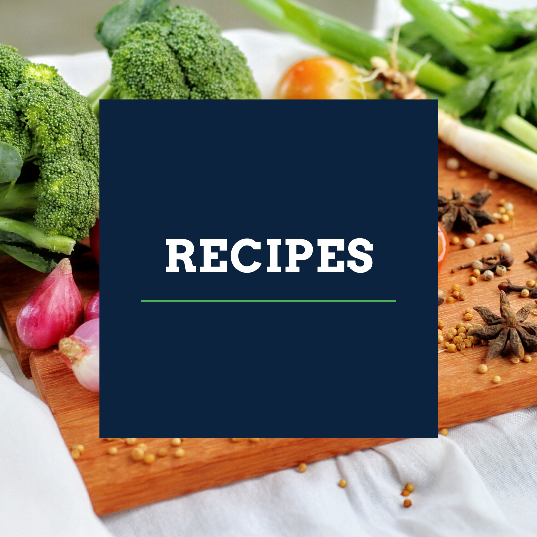 recipes over cutting board and broccoli